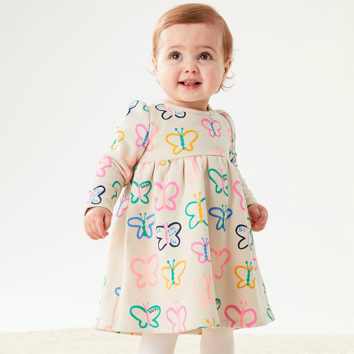 Baby girl wearing butterfly-design dress